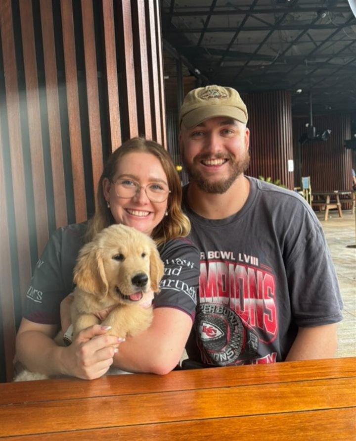 Lachlan, his wife Kate and Maisie the golden retriever puppy, the team behind Golden Marketing